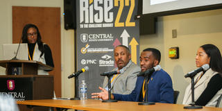 three panelists sit at a table at the 2022 RISE to the Challenge Summit at Central State University with the moderator looking on