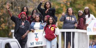 central state university students in the 2023 homecoming parade with a sign saying love my H B C U