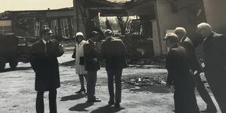 black and white photo of people gathering outside the central state university post office after 1974 tornado