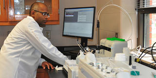 Professor Sakthi Kumaran in a research lab at central state university