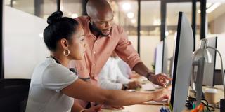 Collaboration, human resources and training with a business black woman talking to her manager or supervisor at work. Teamwork, meeting and management with a man and female employee in the office