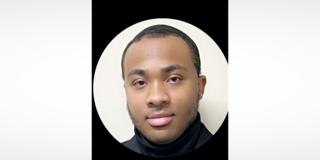 a young black man in a turtleneck sweater