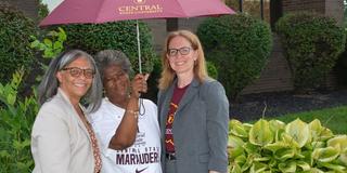 three staff members at university institute