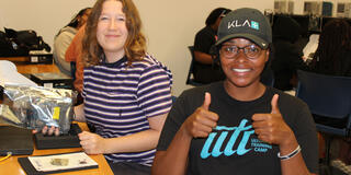 Two Central State University Intel summer interns with one holding two thumbs up