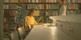 Student studies in the library