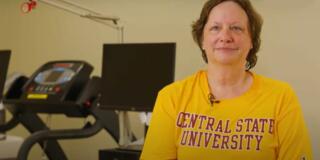 kathleen carter wearing a gold and maroon central state university shirt