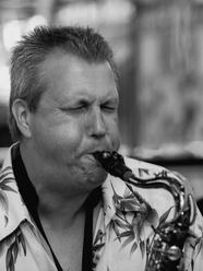 Professor Hal Melia black and white photo of him playing the saxophone