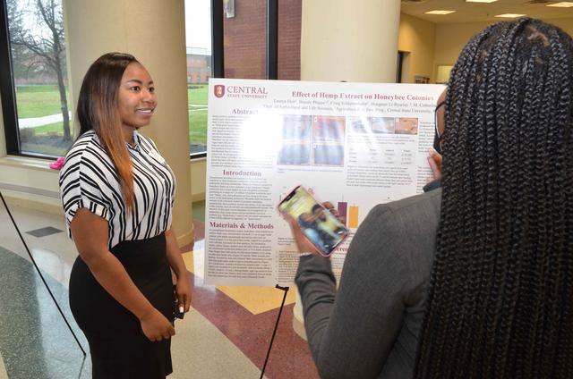 A researcher from Central State University presents her discoveries at the University's Research and Scholarly Activities Day.