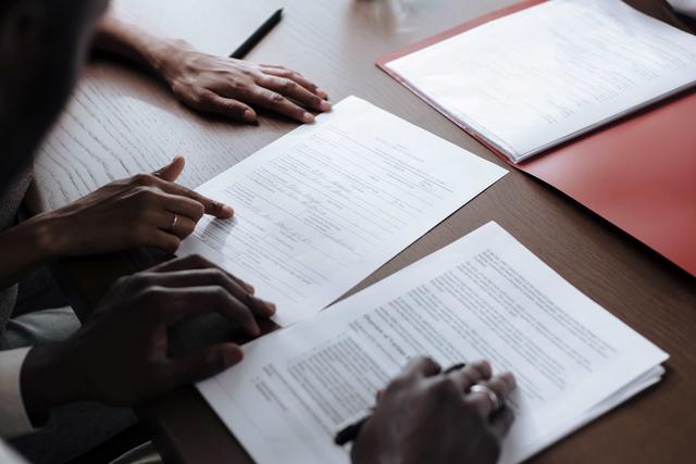 two people review fiscal documents