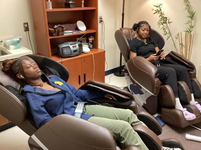 two young Black women use the Central State University Relaxation Room, one of many initiatives spearheaded on campus by Counseling Services