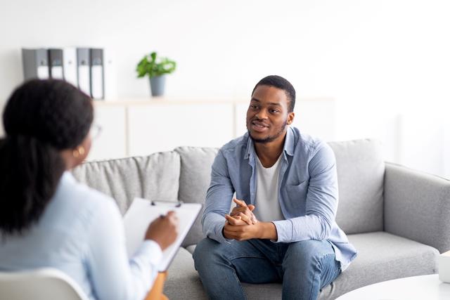 a young African American college student consults with a doctor