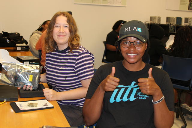 Two Central State University Intel summer interns with one holding two thumbs up