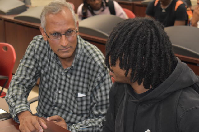 Emdad Ahmed, Ph.D., assistant professor of computer science, with a student