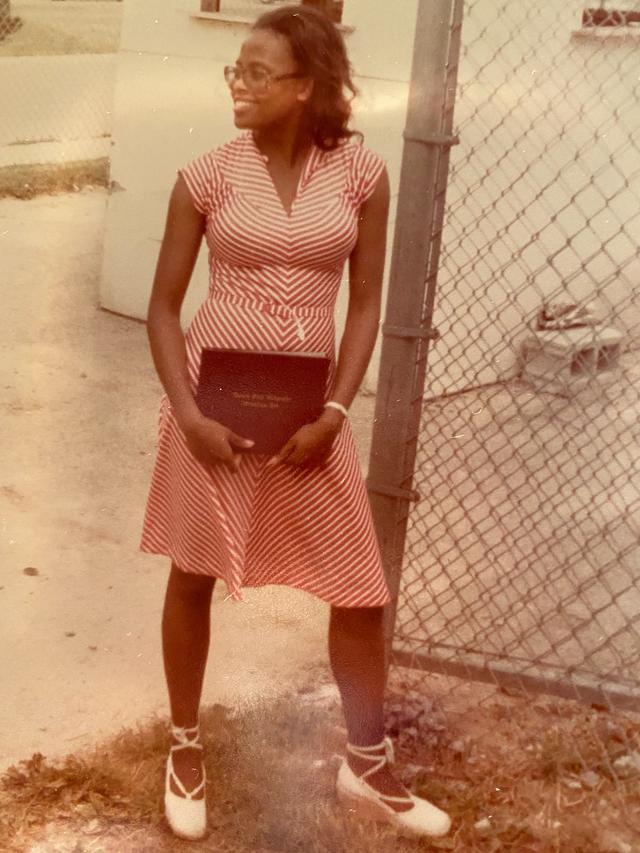 greta winbush holds her diploma after graduating from central state university in 1976