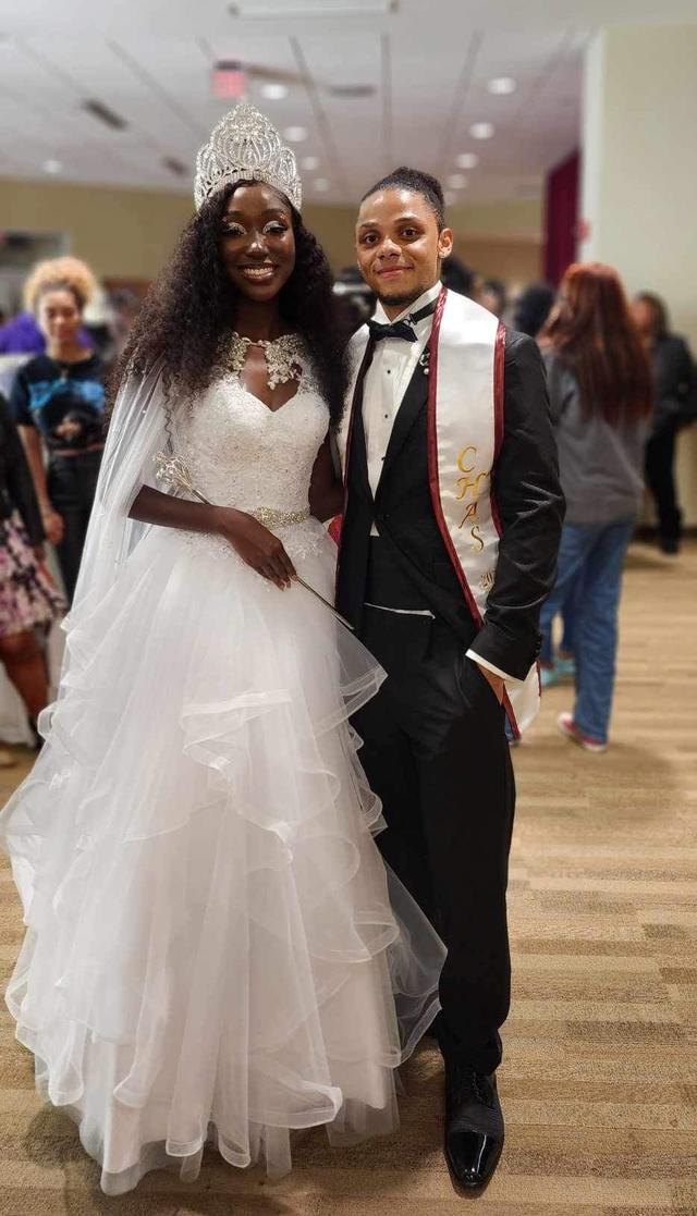 two young Black students dressed up to represent central state university on the royal court