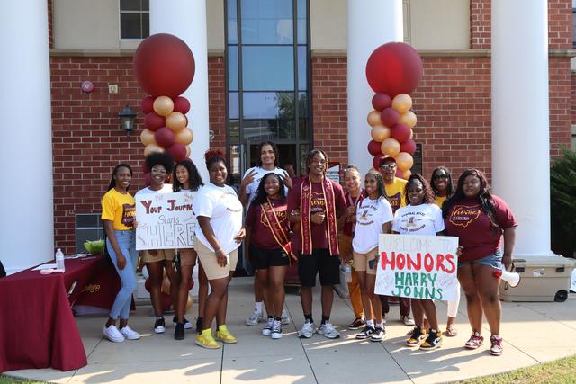 a large group of marauders welcome new students to the honors college at central state university