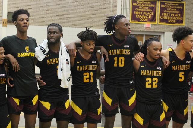 marauder men's basketball team huddles