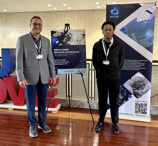 Dr. Mohammadreza Hadizadeh and Kayvon Adderley in front of research posters