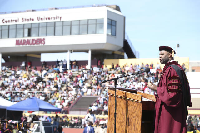 doctor myron rolle speaks at central state university commencement in front of a large crowd at william patrick mcpherson memorial stadium