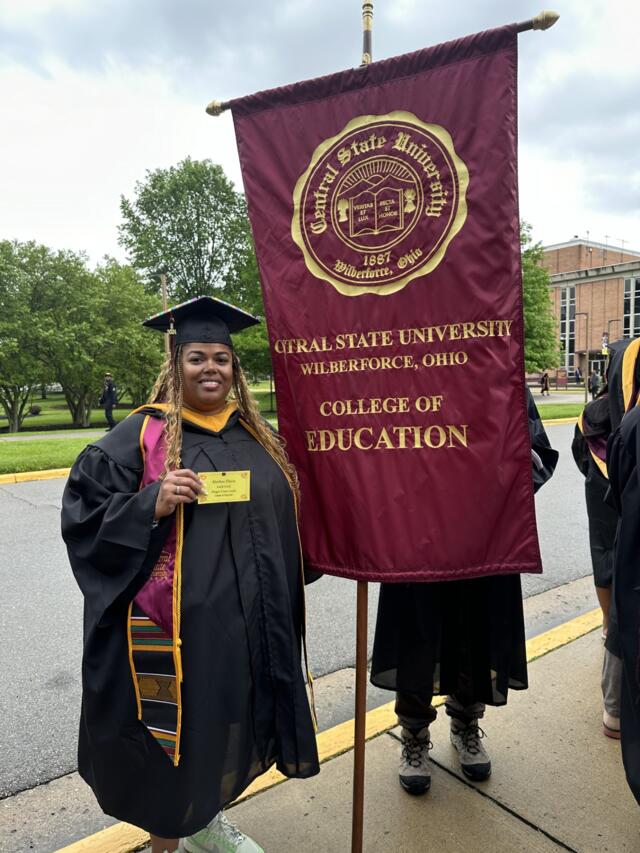 alethea davis beside central state university college of education banner