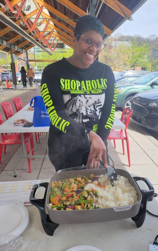 a person cooks near findlay market