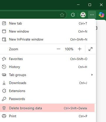 Microsoft Edge options menu open in the top-right corner, showing items such as New tab, History, Downloads, Extensions, and Settings, with ‘Delete browsing data…’ highlighted in red.