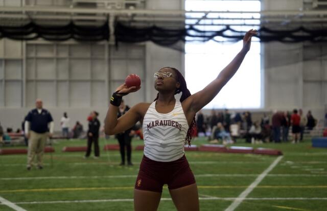 Alum Darcey Dorris doing shot put
